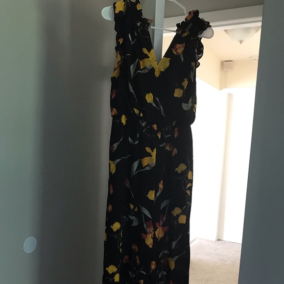 black jumpsuit with yellow flowers